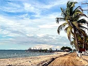 Beach with port activity, Caribbean coast